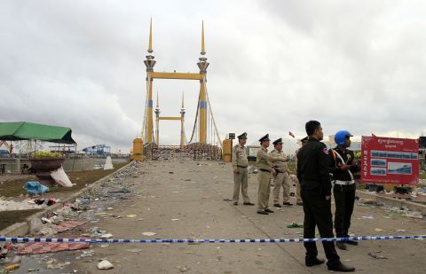 Police cordon off a bridge in the early morning in Phnom Penh on November 23, 2010 following a stampede that killed at least 350 people.