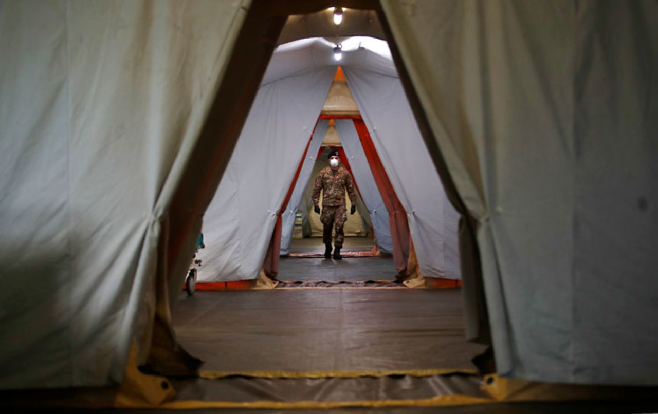 An Italian soldier walks inside the field hospital built in Crema, Italy, on Tuesday, March 24.