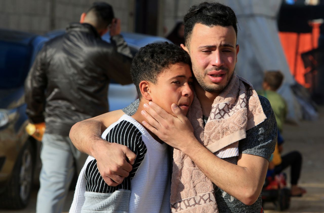 People mourn relatives who were killed after an Israeli attack, at the Al Merouani Field Hospital in Rafah, Gaza, on May 7.