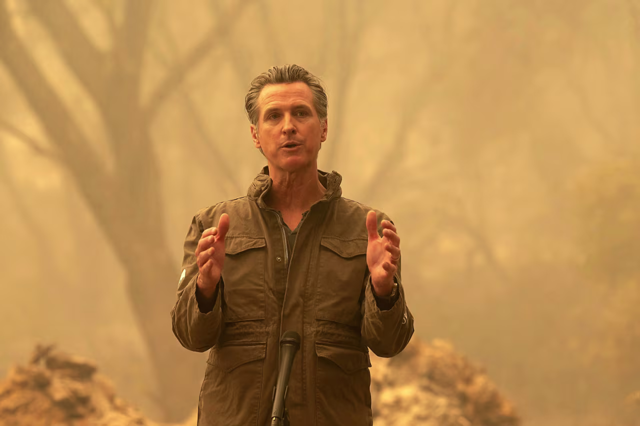 California Gov. Gavin Newsom speaks to the media outside of Oroville, California, after viewing the North Complex Fire zone on September 11.