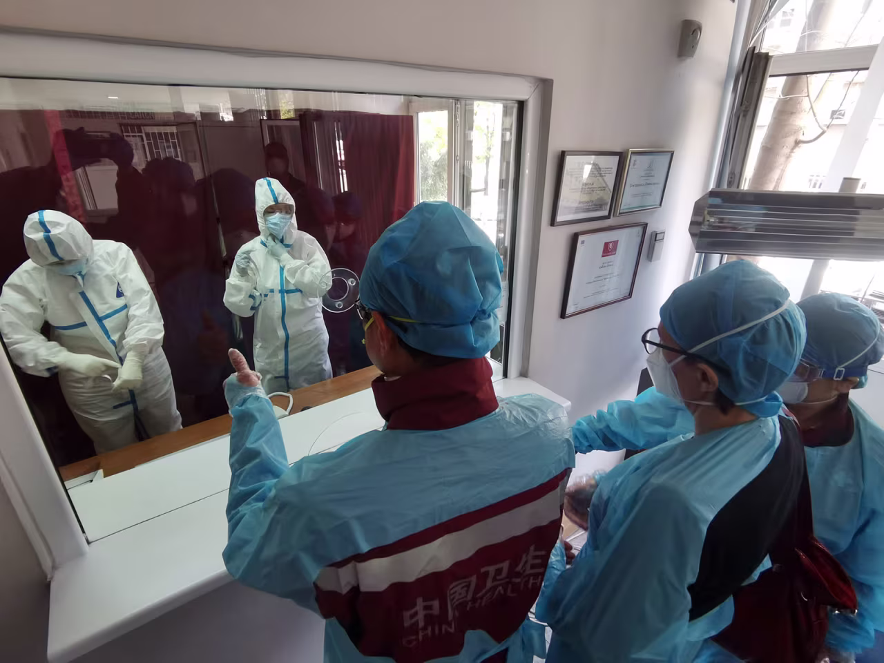 Members of a Chinese medical team visit a clinic in Belgrade, Serbia, on April 11.