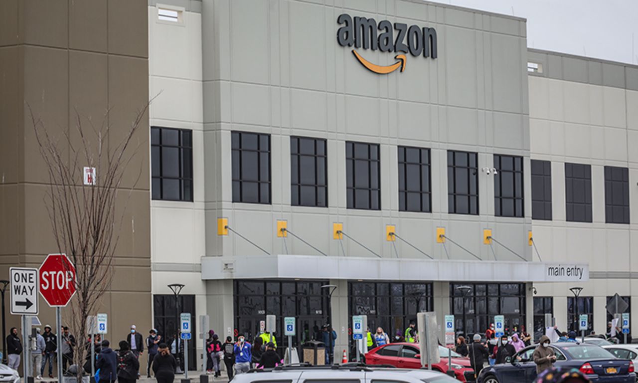 Workers at Amazon's fulfillment center in Staten Island, New York, gather outside to protest work conditions in the company's warehouse,on Monday, March 30.