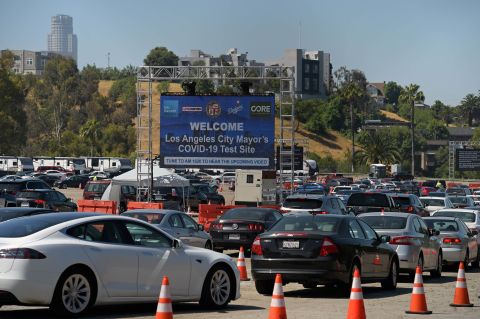 Cars line-up in a drive-through novel coronavirus testing site at the Los Angeles Dodgers stadium parking lot, in Los Angeles, on May 26. 