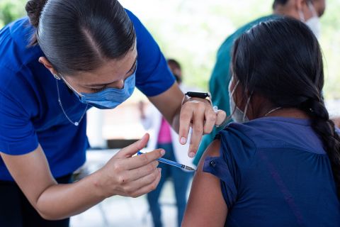 A health worker administers a dose of the AstraZeneca vaccine in Mexico City on August 4.