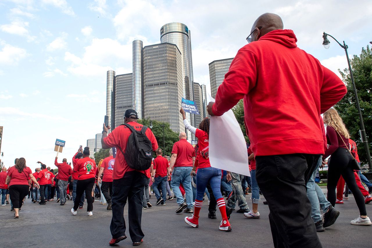 Members of the United Auto Workers (UAW) union march through the streets of downtown Detroit following a rally on the first day of the UAW strike in Detroit, Michigan, on September 15.