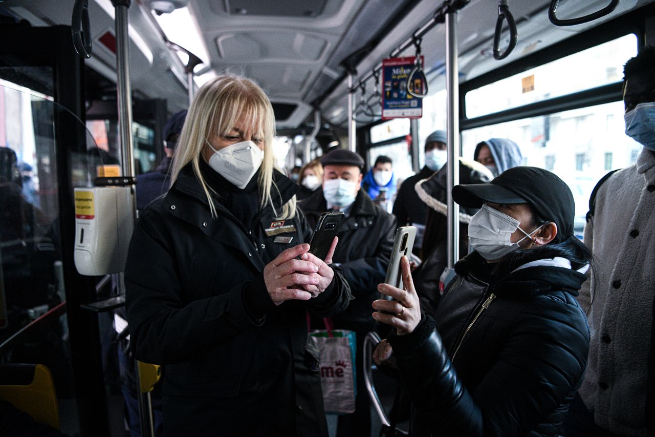 ATM personnel check Covid-19 health passes of passengers on a bus as new measures come into effect to fight the spread of Covid-19 and to boost vaccinations in Milan, Italy on December 6th, 2021. 