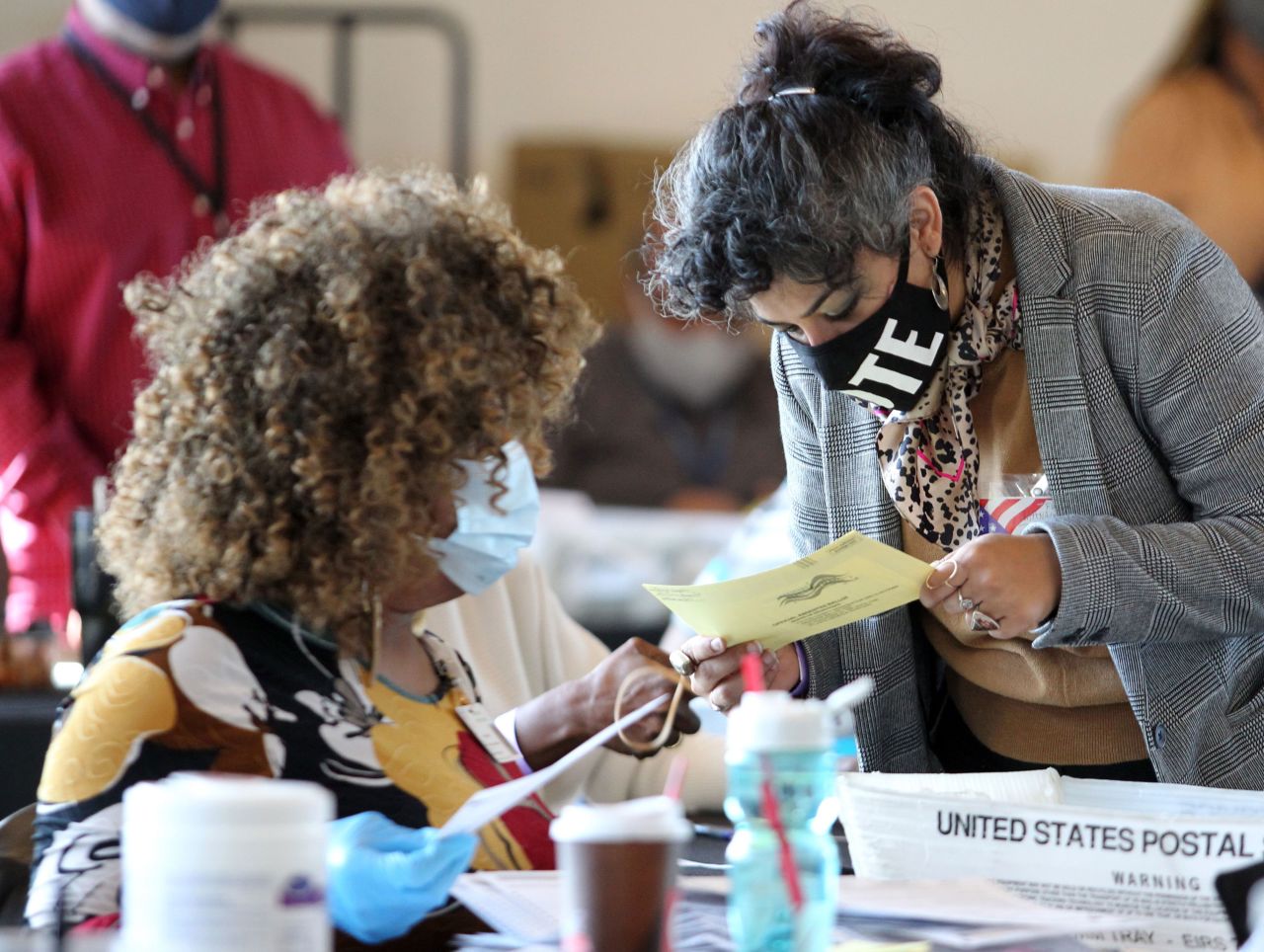 Election workers examine ballots in Atlanta on November 5.