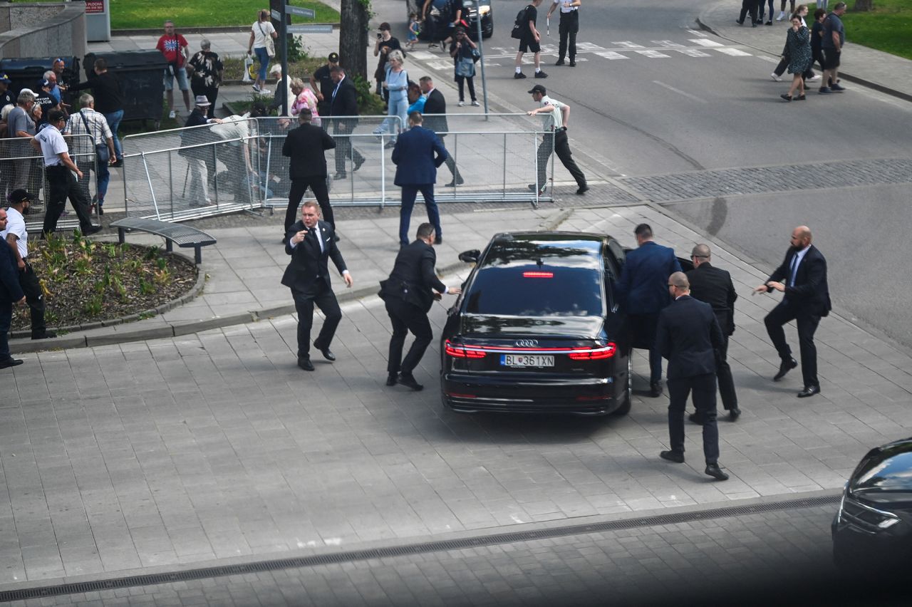Security officers move Slovak PM Robert Fico in a car after a shooting incident, after a Slovak government meeting in Handlova, Slovakia, on May 15.