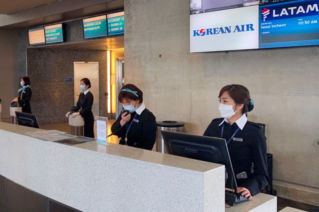 Korean Air employees are seen at Los Angeles International Airport (LAX) wearing masks, to prevent the coronavirus infection,COVID-19 on February 12.