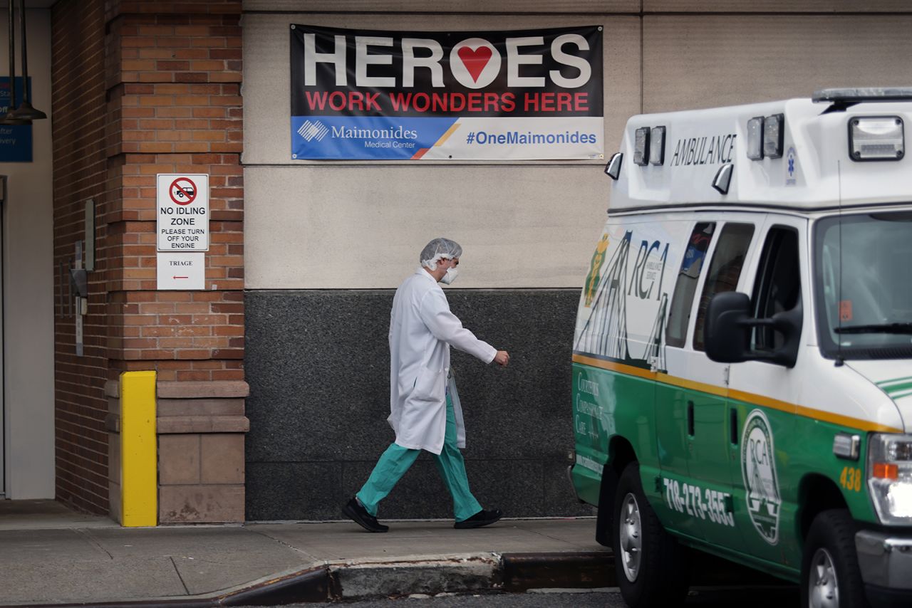 A medical worker walks outside of the Maimonides Medical Center in Brooklyn on December 1 in New York.