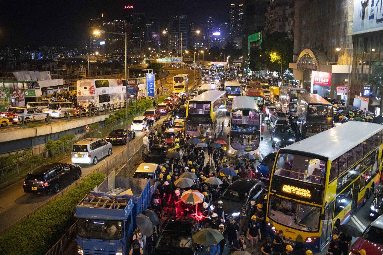 Protesters seen bringing traffic to a standstill on Hong Kong's Gloucester Road in Causeway Bay, one of the busiest thoroughfares in Hong Kong.