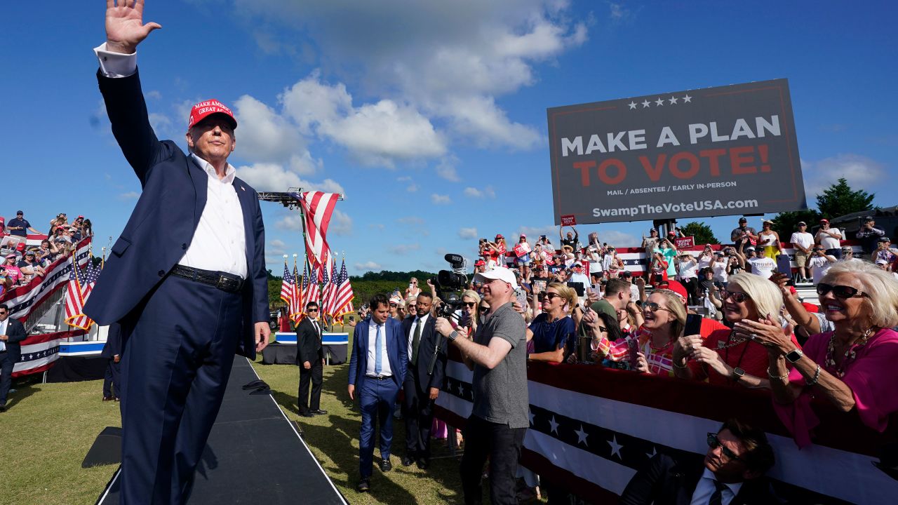 Former President Donald Trump waves to the crowd at a campaign rally in Chesapeake, Virginia on June 28. 