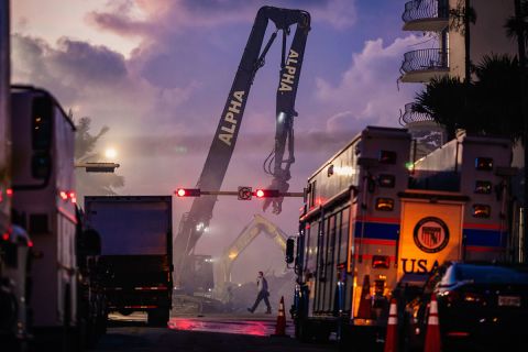 Members of the Miami-Dade Fire Rescue team and excavation crews work to remove debris and search the Champlain Towers South collapse site in Surfside on June 26.