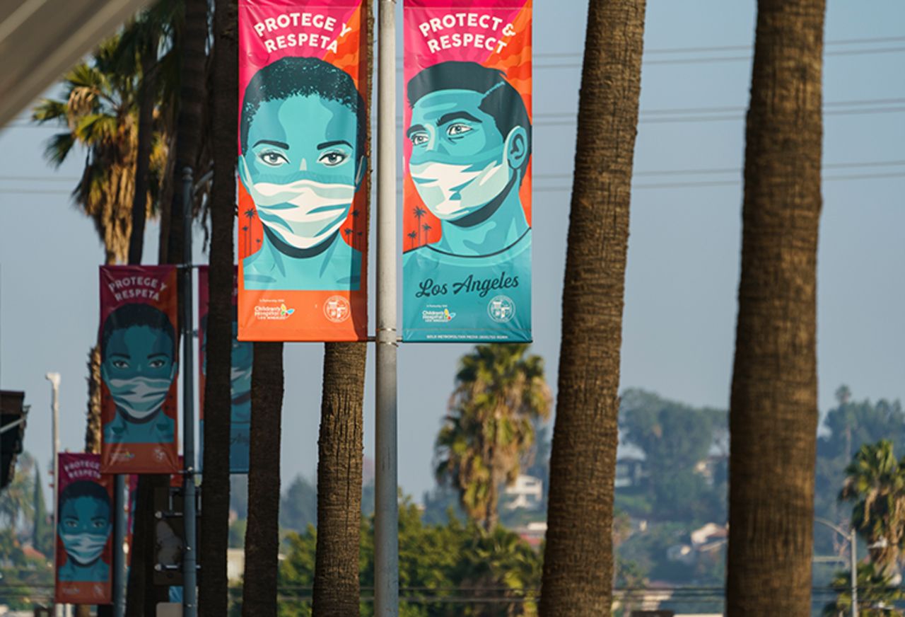 Banners advising people to wear masks against the coronavirus hang along Hollywood Boulevard in Los Angeles on Tuesday, Jan. 5, 2021. 