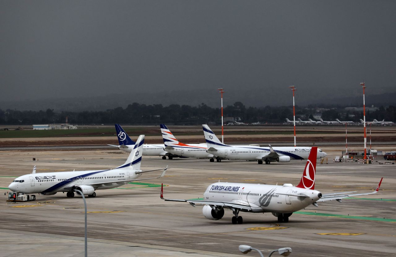 Planes sit on the tarmac at Israel's Ben Gurion Airport in Lod, east of Tel Aviv, on December 21, 2021.