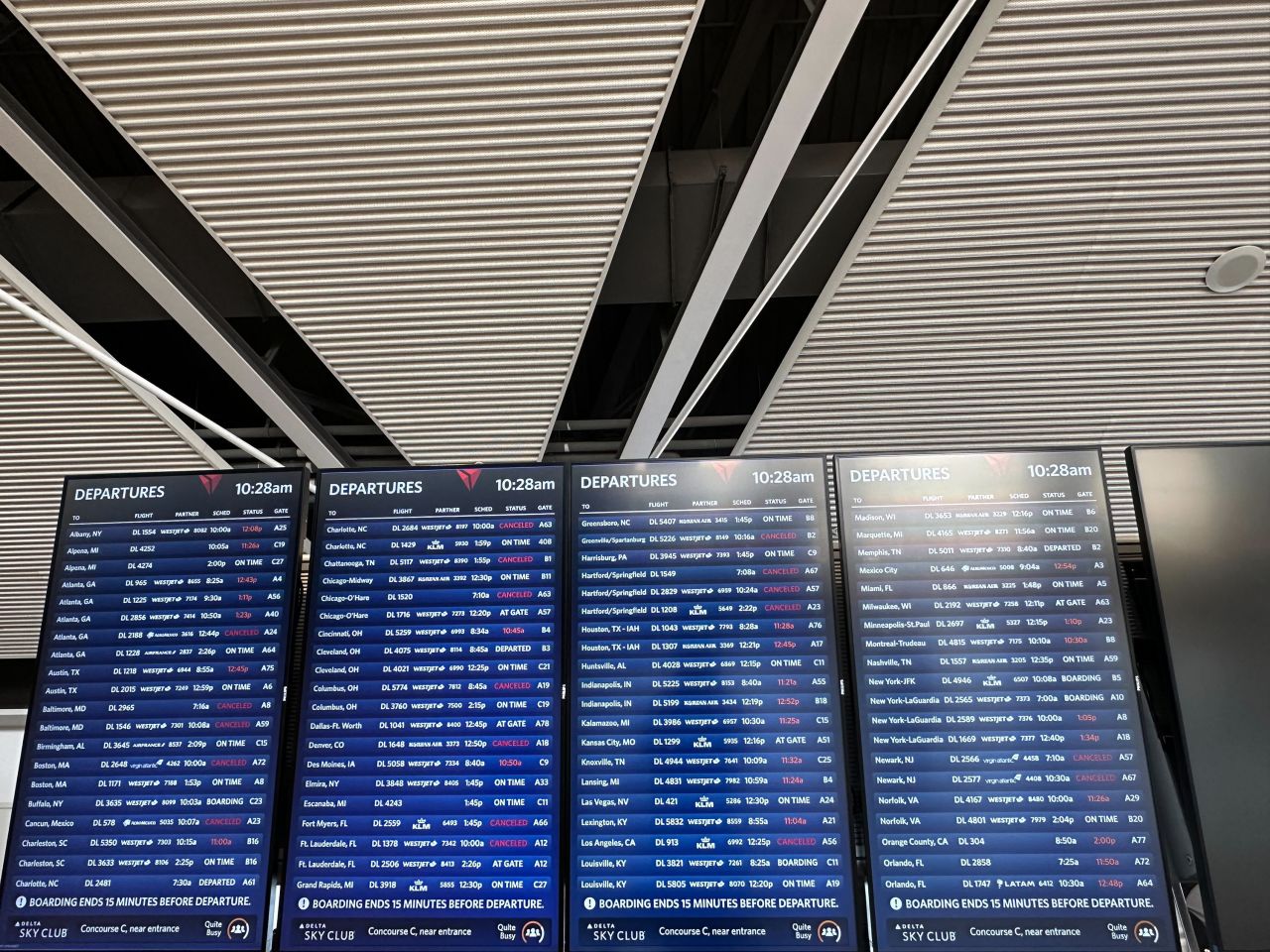 Flight information is seen during a technology outage at Detroit Metropolitan Wayne County Airport on July 19.