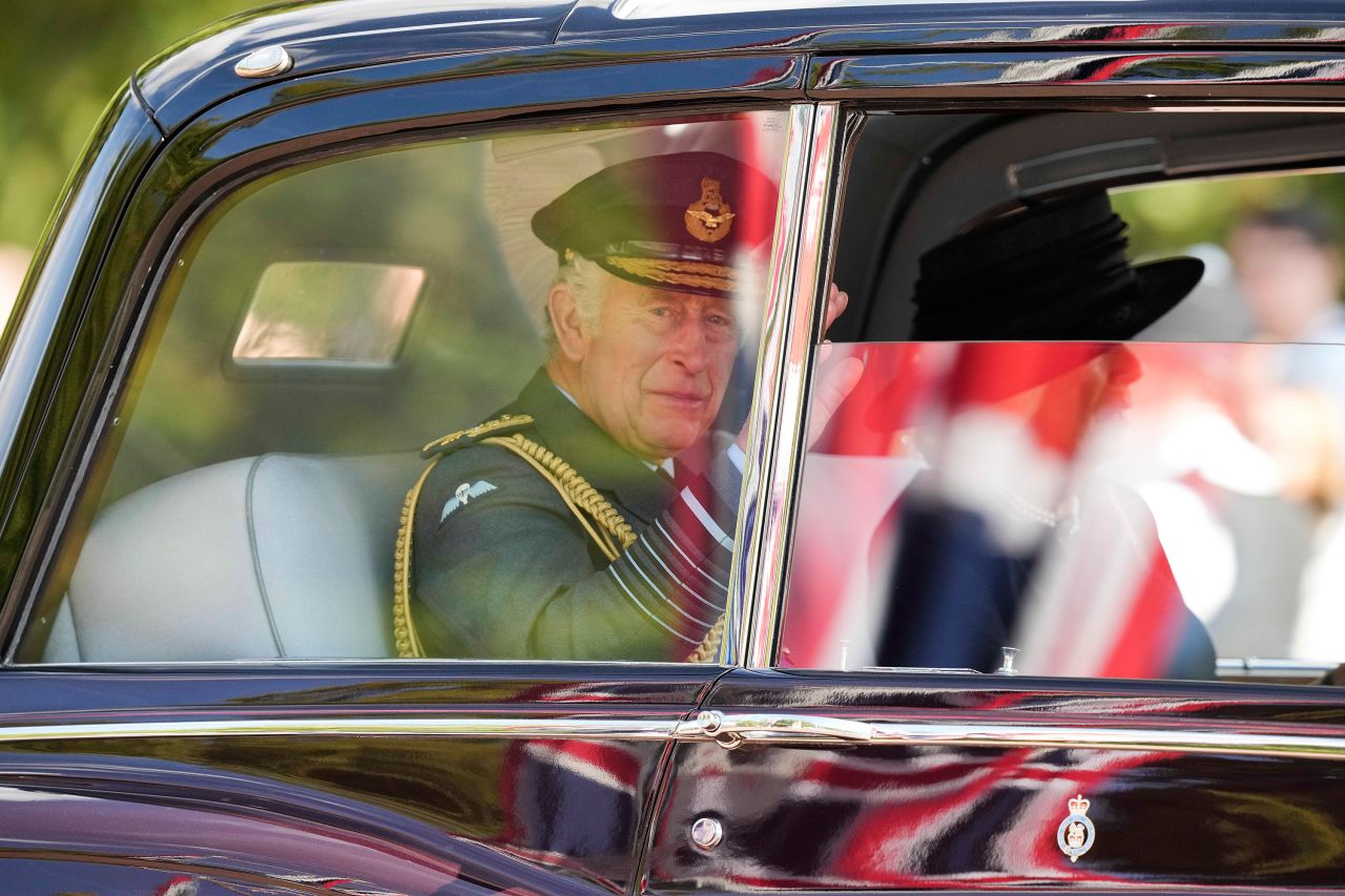 King Charles III and Camilla, the Queen Consort leave Westminster Hall after the procession.