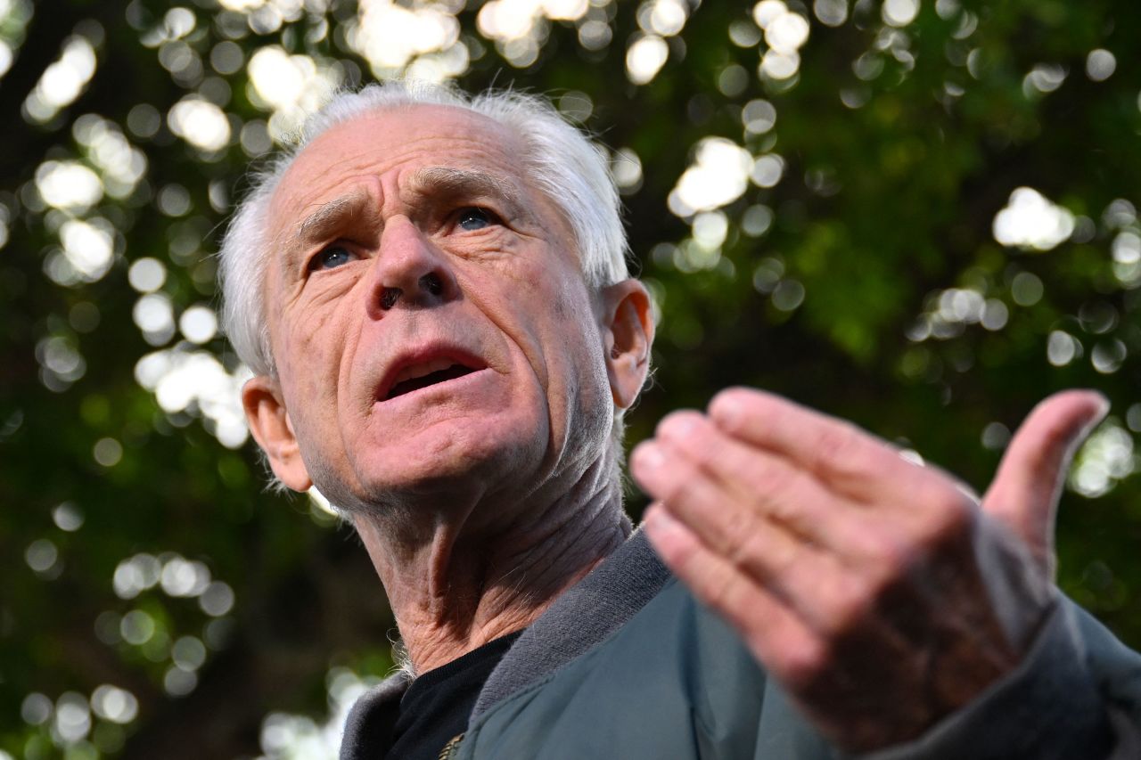 Peter Navarro speaks to the press before reporting to the Federal Correctional Institution in Miami in March.