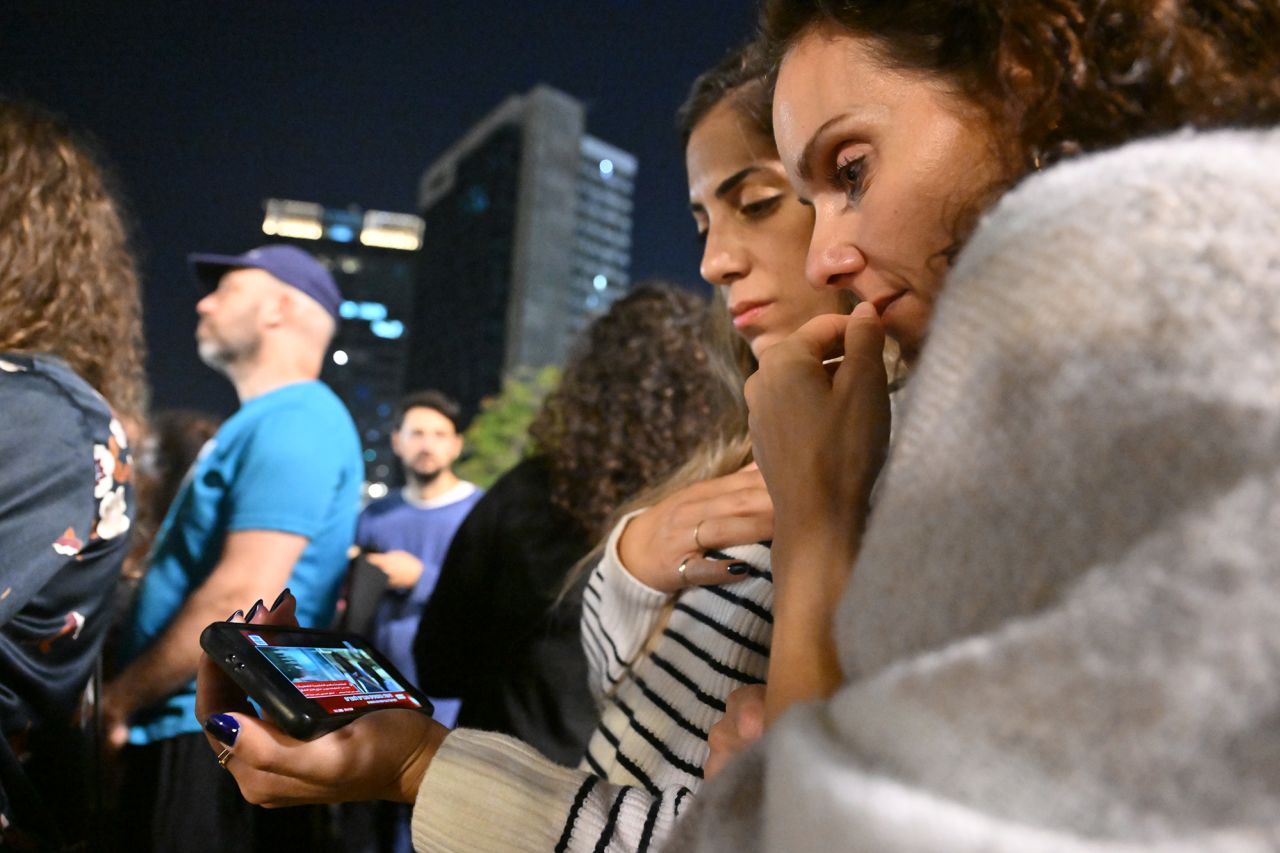 Families of the hostages and others watch news broadcasts as hostages are released into Egypt before being brought into Israel by the ICRC, outside the Museum of Tel Aviv, Israel, on November 24.