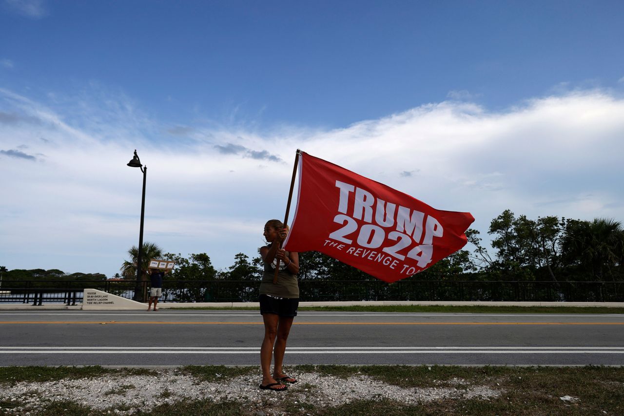 A supporter of former President Donald Trump joins a small gathering near Mar-a-Lago on May 30, in Palm Beach, Florida. 