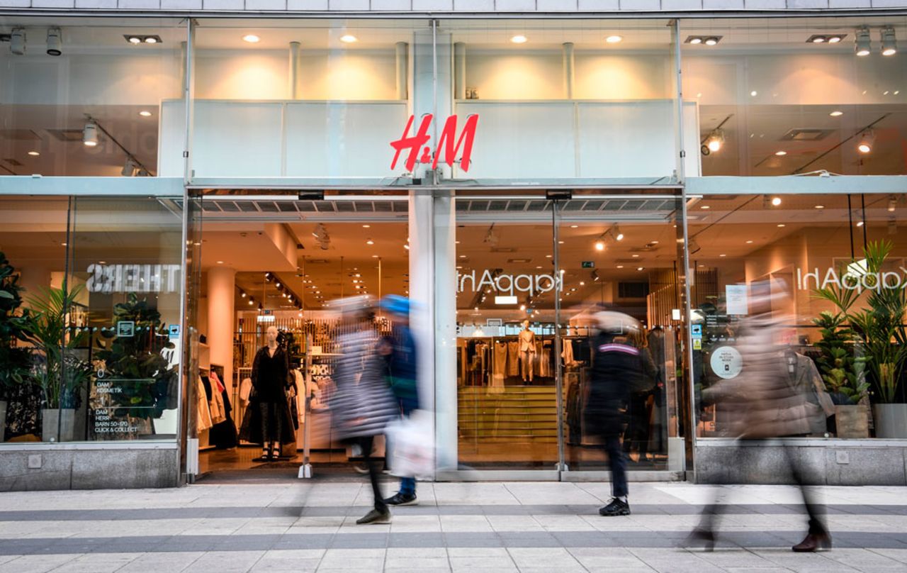 Shoppers walk past an H&M in central Stockholm on April 2. 