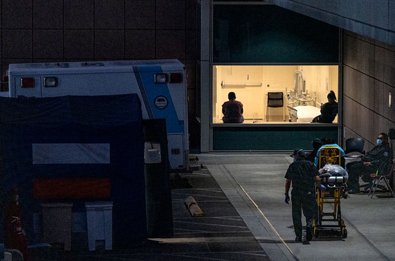 Emergency Medical Services transfers a patient at the Los Angeles County + USC Medical Center hospital in Los Angeles on Wednesday, December 16. 