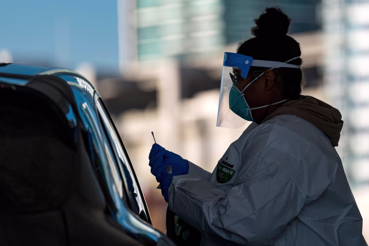 A healthcare worker administers a nasal swab at a Covid-19 testing site in San Francisco, California, on December 1.