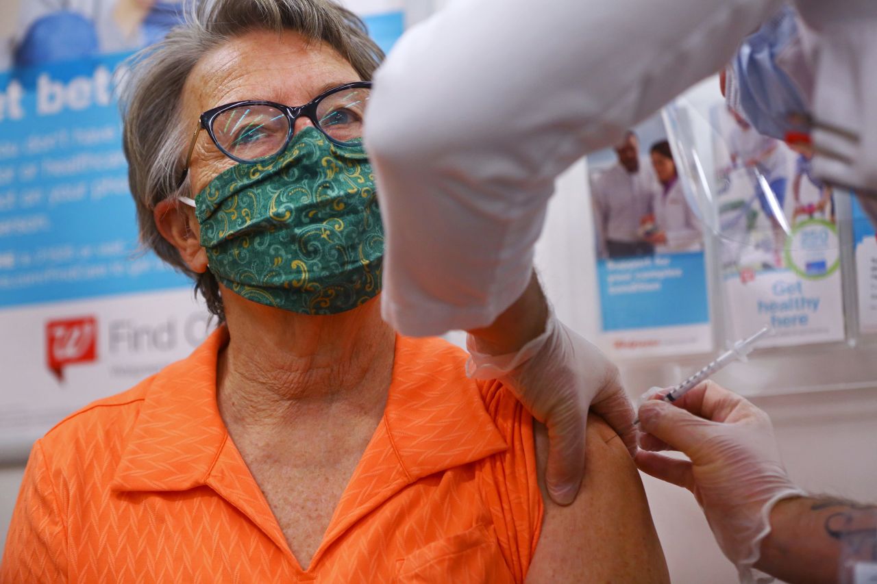 A pharmacist administers a Covid-19 vaccine at a Walmart Pharmacy in Danvers, Massachusetts, on February 1.