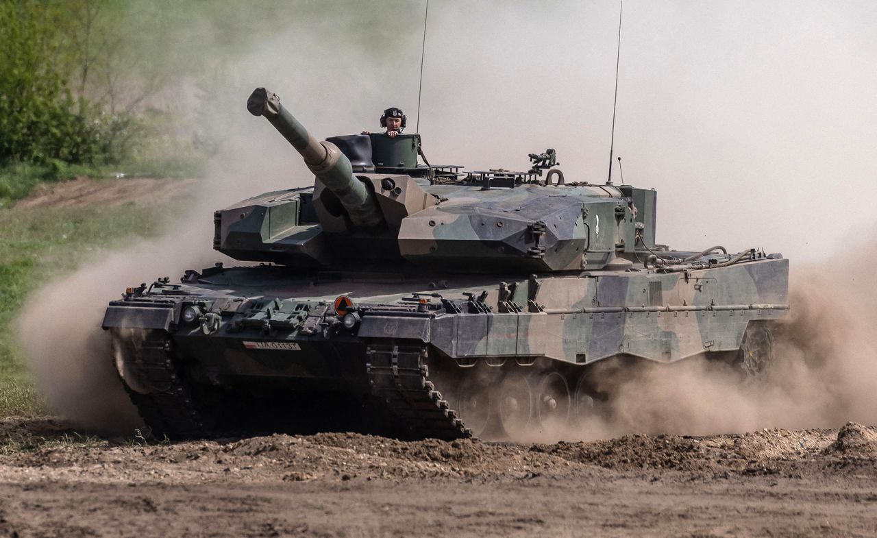 Soldiers on a Polish Leopard tank take part in the DEFENDER-Europe 22 military exercise, in Nowogard, Poland, on May 19, 2022.
