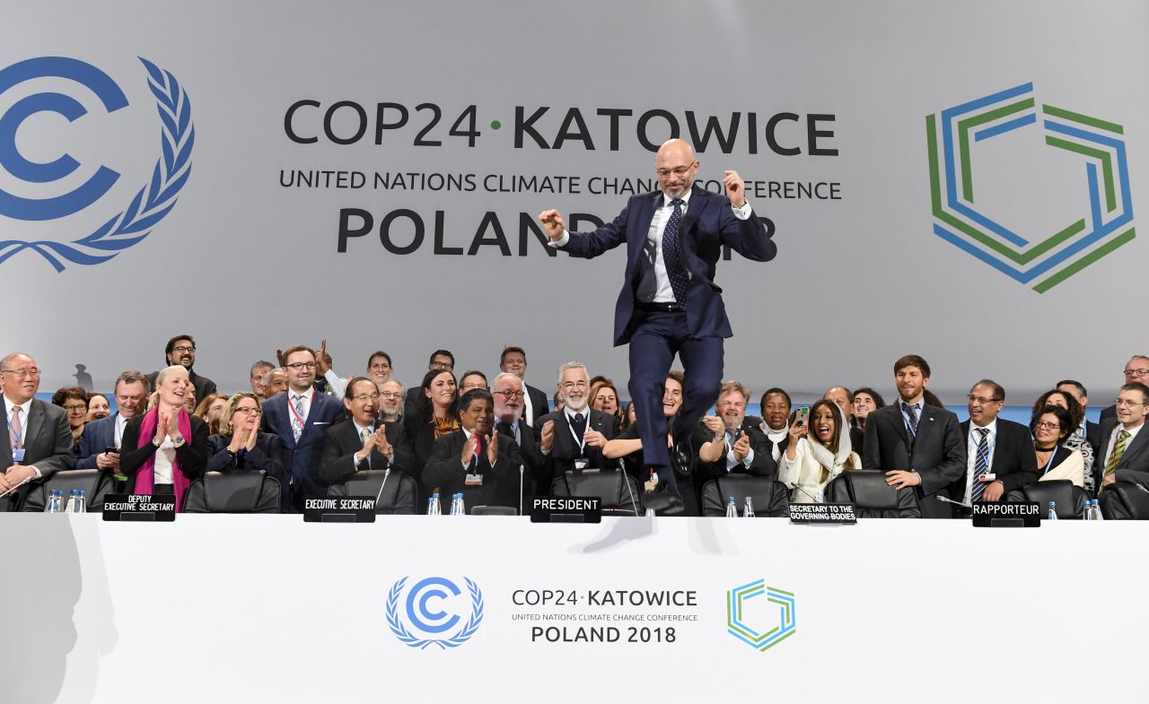 COP24 President Michal Kurtyka celebrates at the end of the conference's final session.