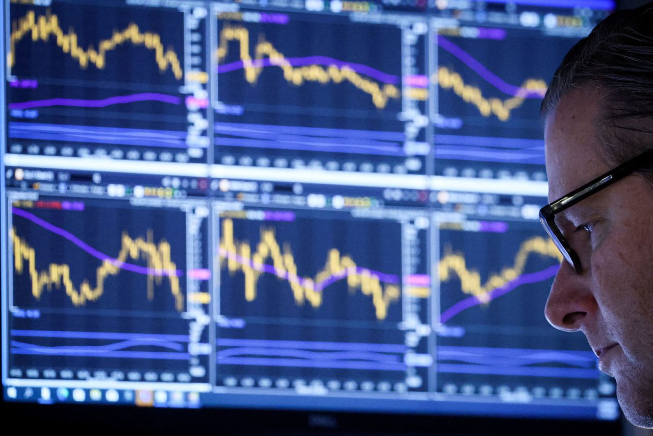 A specialist trader works inside a post on the floor of the New York Stock Exchange on March 14. 