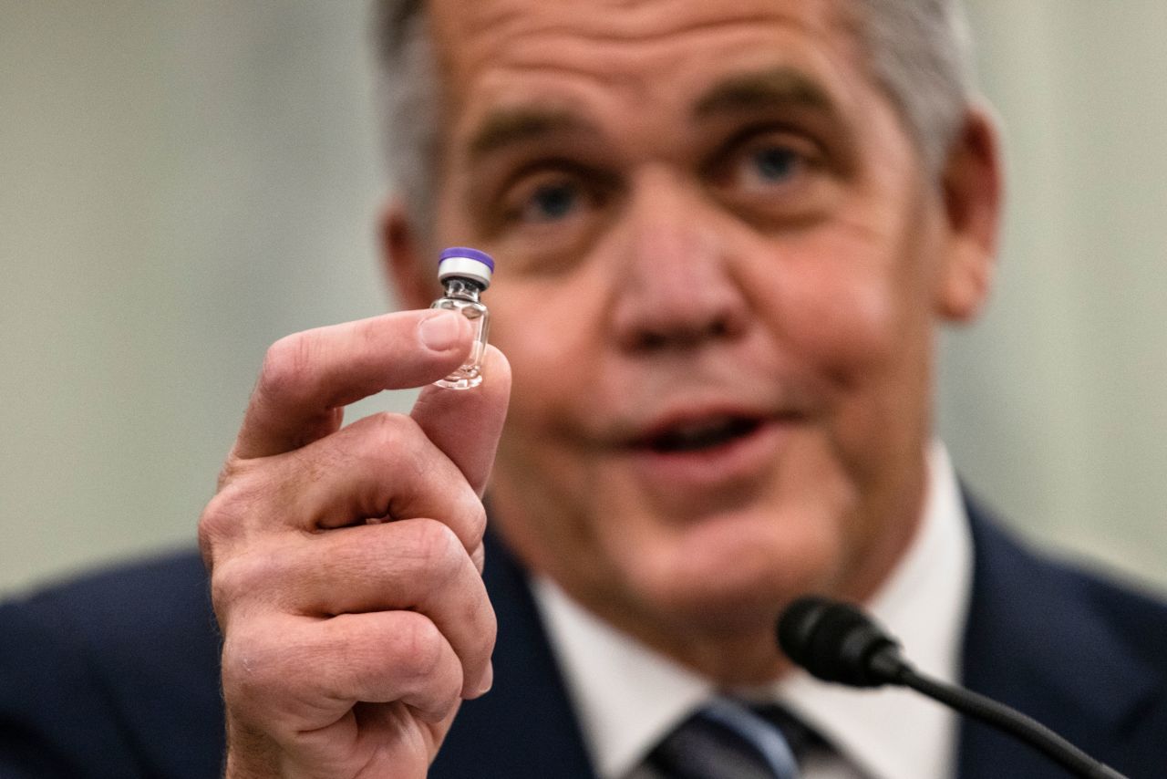 UPS President of Global Healthcare Wesley Wheeler holds an example of the vial that will be used to transport the Pfizer COVID-19 vaccine as he speaks on Capitol Hill, on Thursday, December 10.