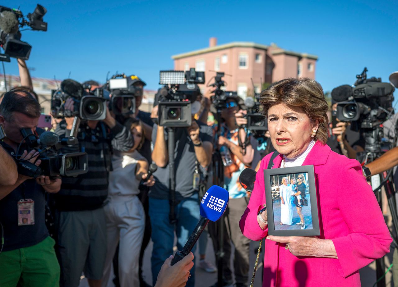 Gloria Allred holds a picture of Halyna Hutchins outside a district court in Santa Fe, New Mexico, Wednesday, July 10.