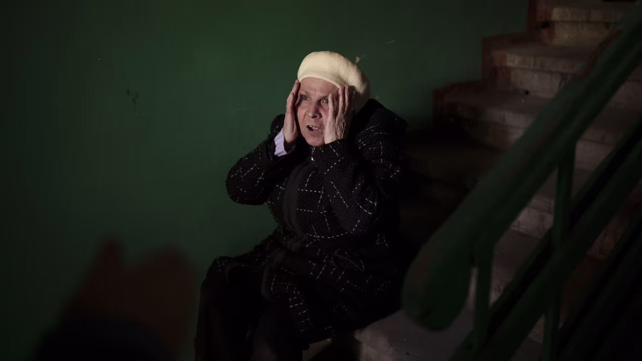 A woman reacts to the death of a 15-year-old boy killed during a Russian attack in Kharkiv, Ukraine on Friday April 15.