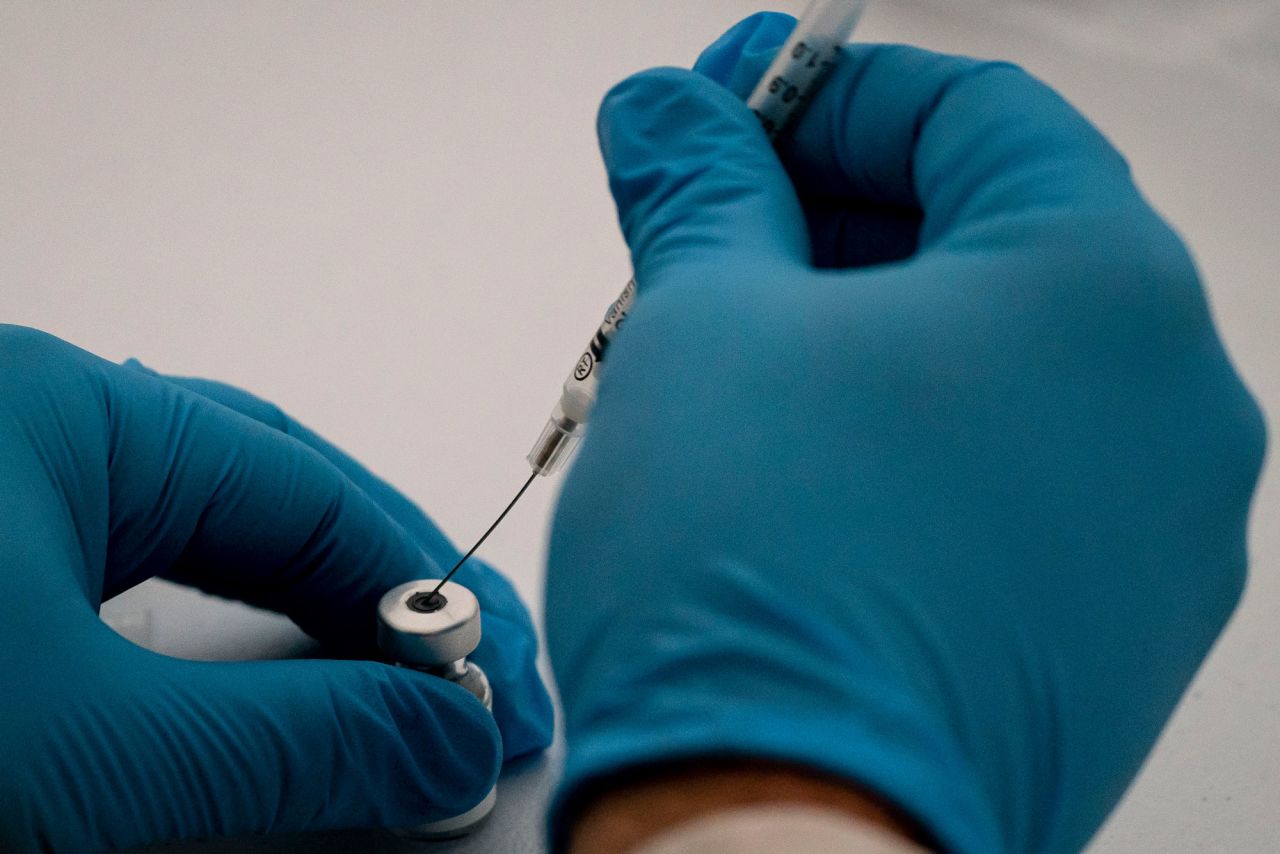 A pharmacist prepares COVID-19 vaccines for patients arriving at Town Toyota Center on January 26 in Wenatchee, Washington. 