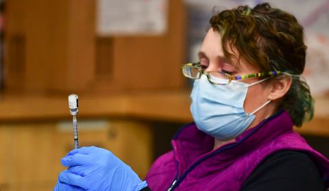 Registered Nurse Morgan James loads a syringe with a dose of the Pfizer Covid-19 vaccine in Anchorage, Alaska, on March 19.