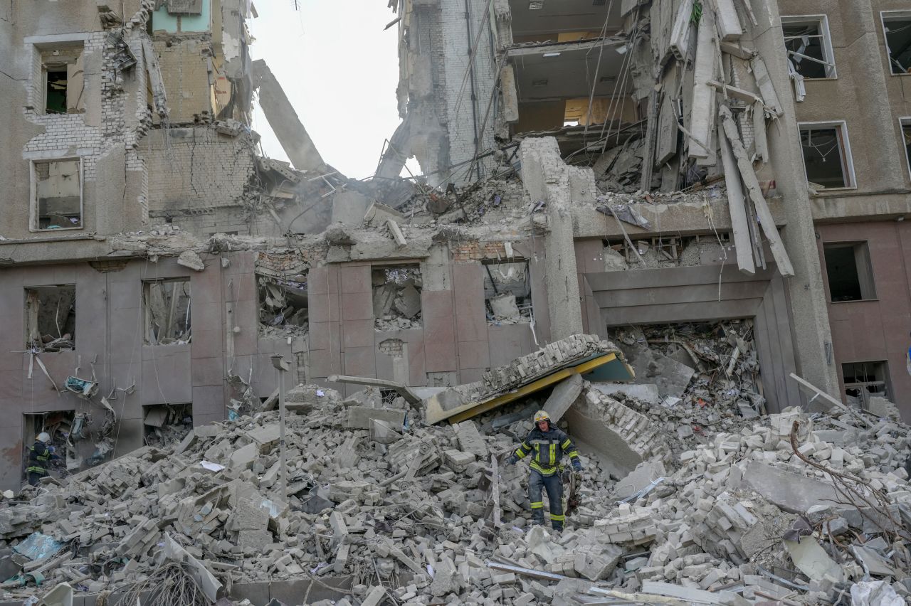 A firefighter clears the rubble of a government building hit by Russian rockets in Mykolaiv, Ukraine, on March 29, 