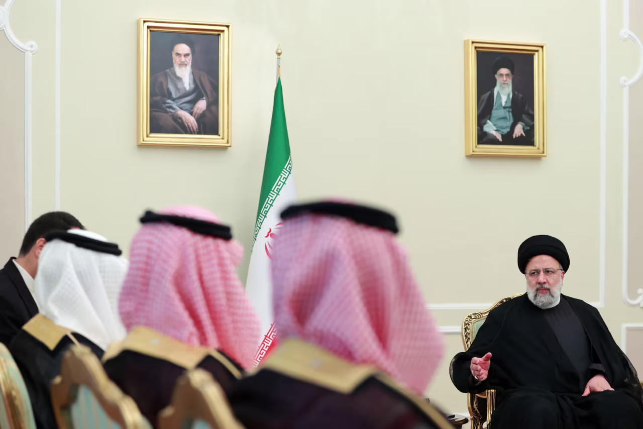 Iranian President Ebrahim Raisi welcomes the Saudi Ambassador to Iran in Tehran on October 24.