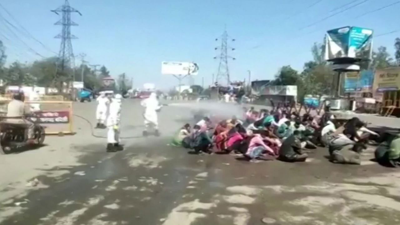 Workers are sprayed with disinfectant in Uttar Pradesh, India.