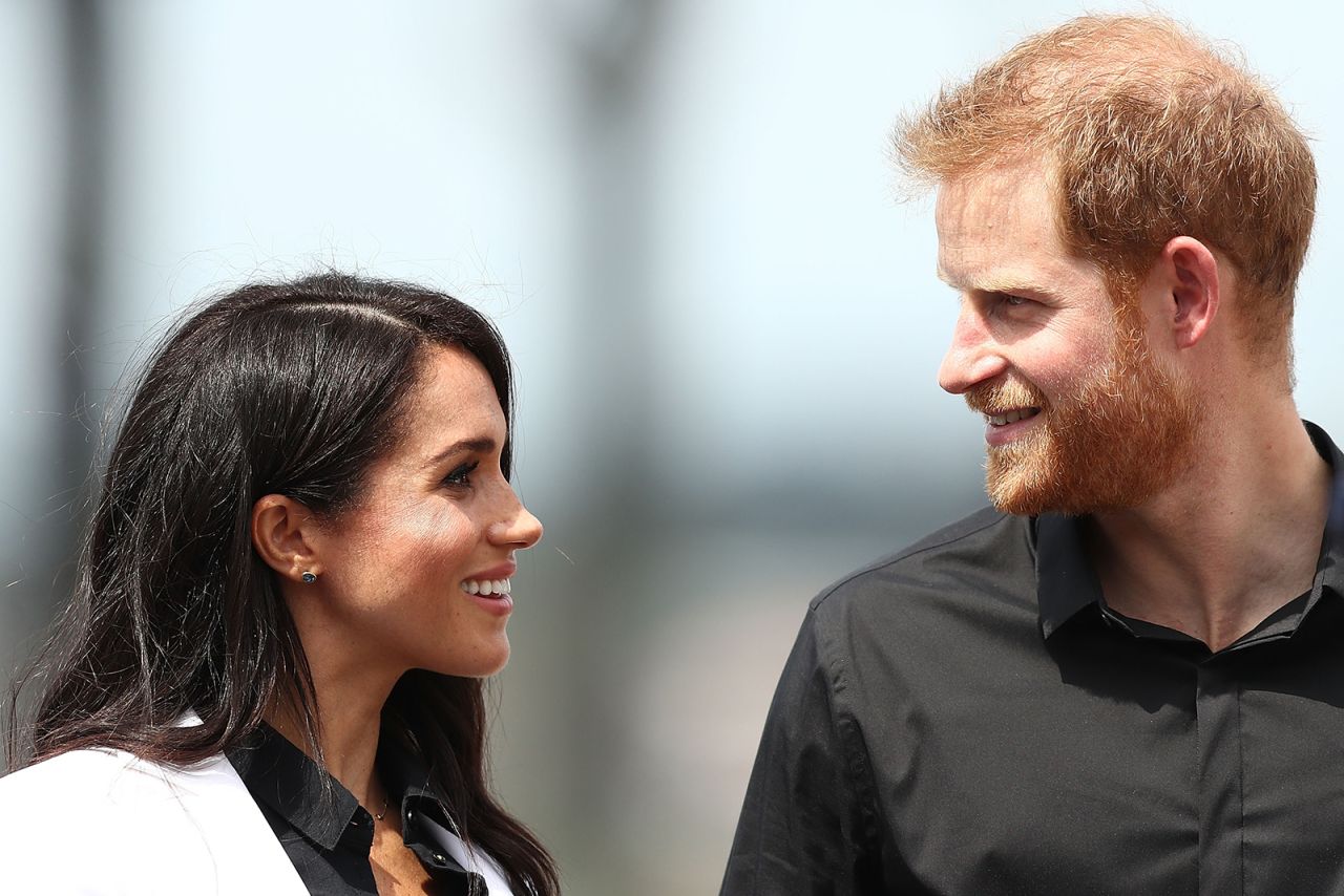 Prince Harry, Duke of Sussex and Meghan, Duchess of Sussex look at each other during the JLR Drive Day at Cockatoo Island on October 20, 2018 in Sydney.