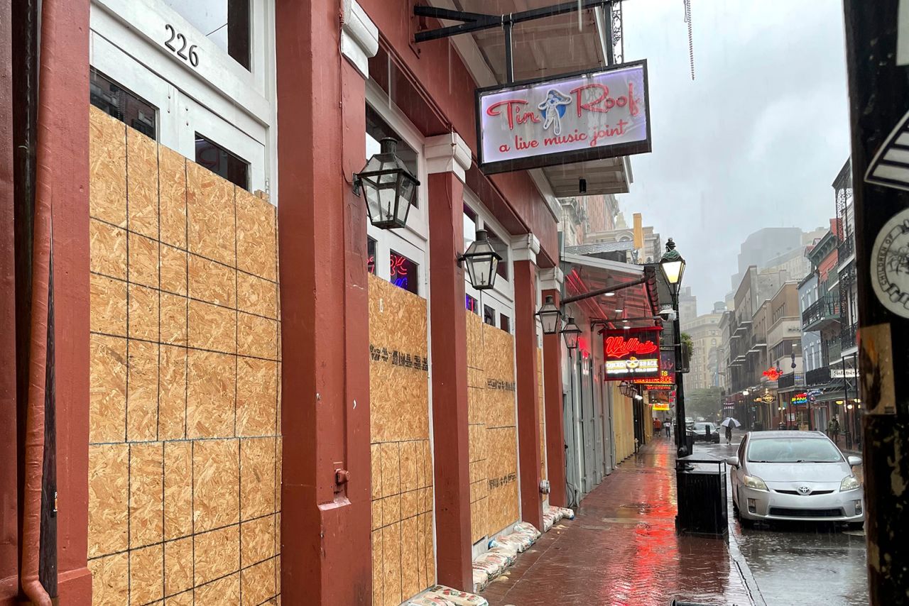 Boarded windows and sandbags cover the windows of a Bourbon Street bar in New Orleans on September 11.