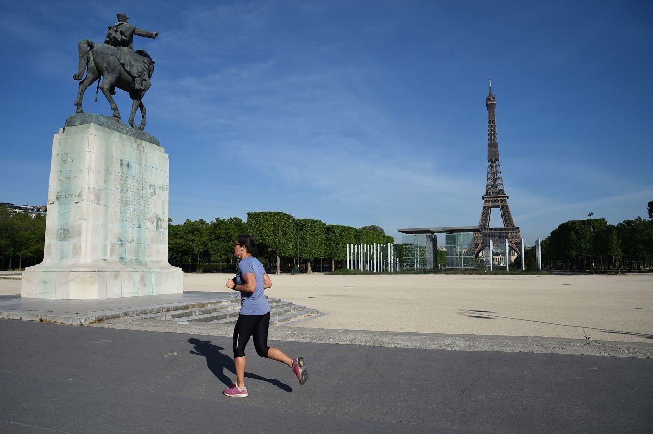 A jogger runs in Paris, on May 7.