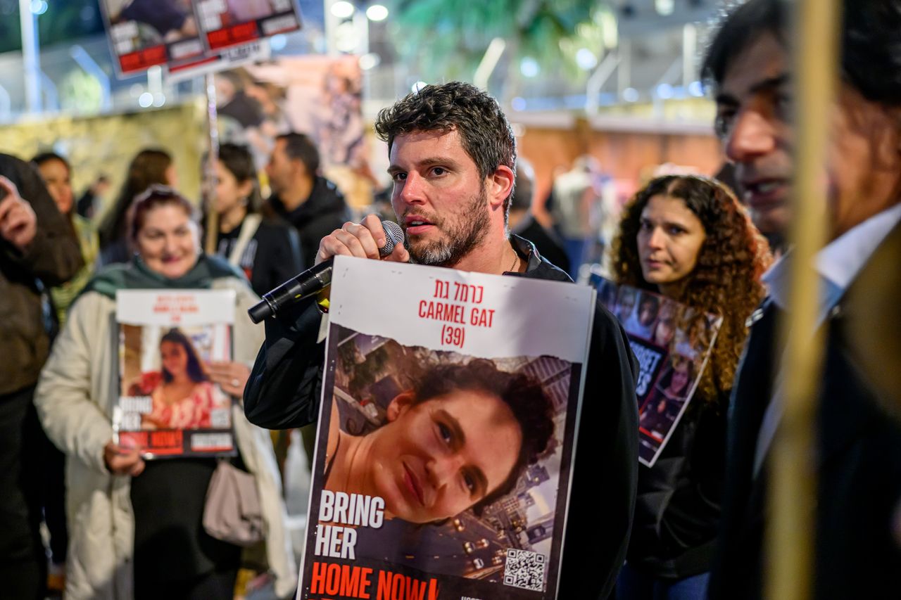 Gil Dickmann, cousin of hostage Carmel Gat, speaks to the crowd as family members and supporters gathered in Tel Aviv, Israel, on February 20.