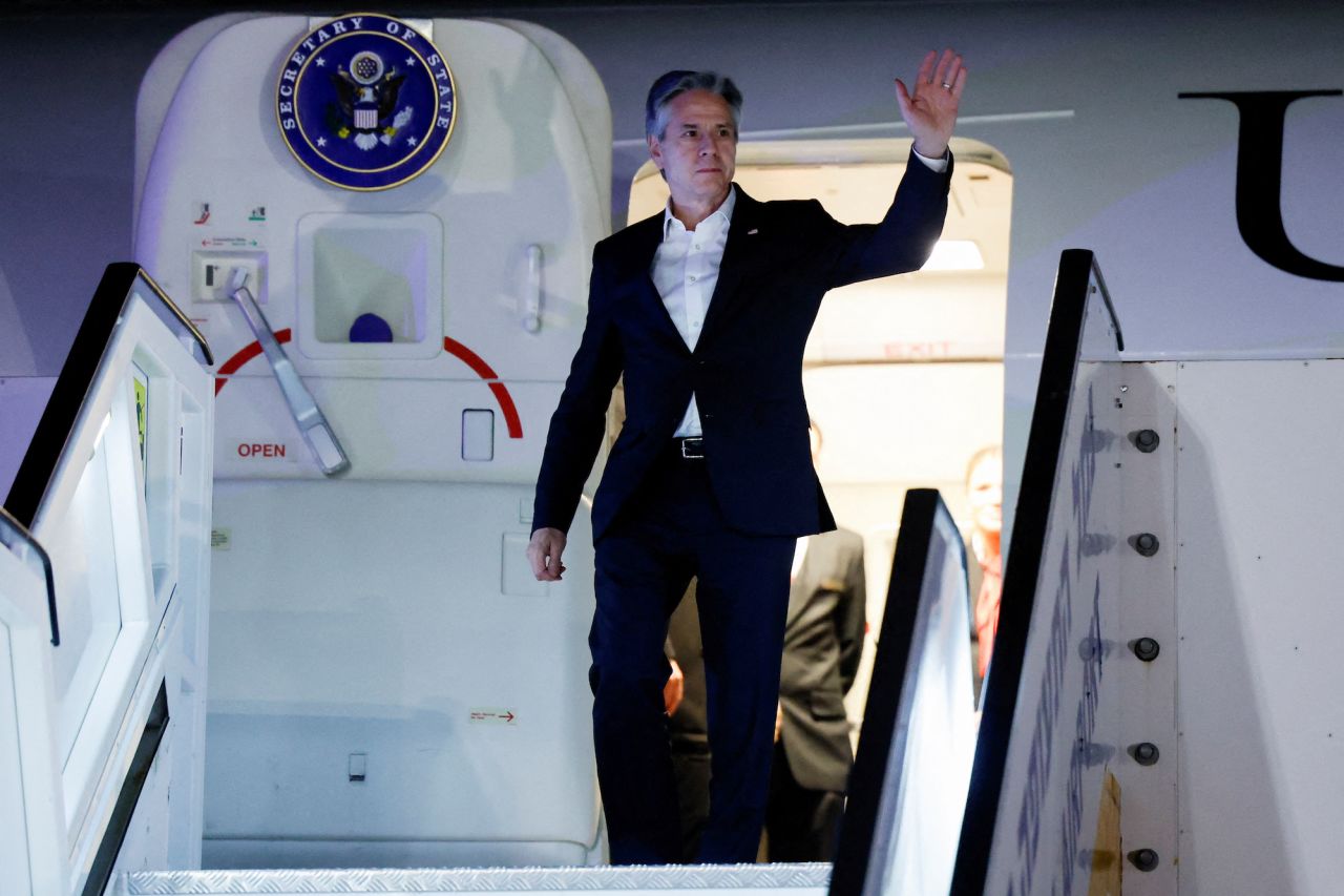 Secretary of State Antony Blinken waves as he arrives in Tel Aviv on Monday.