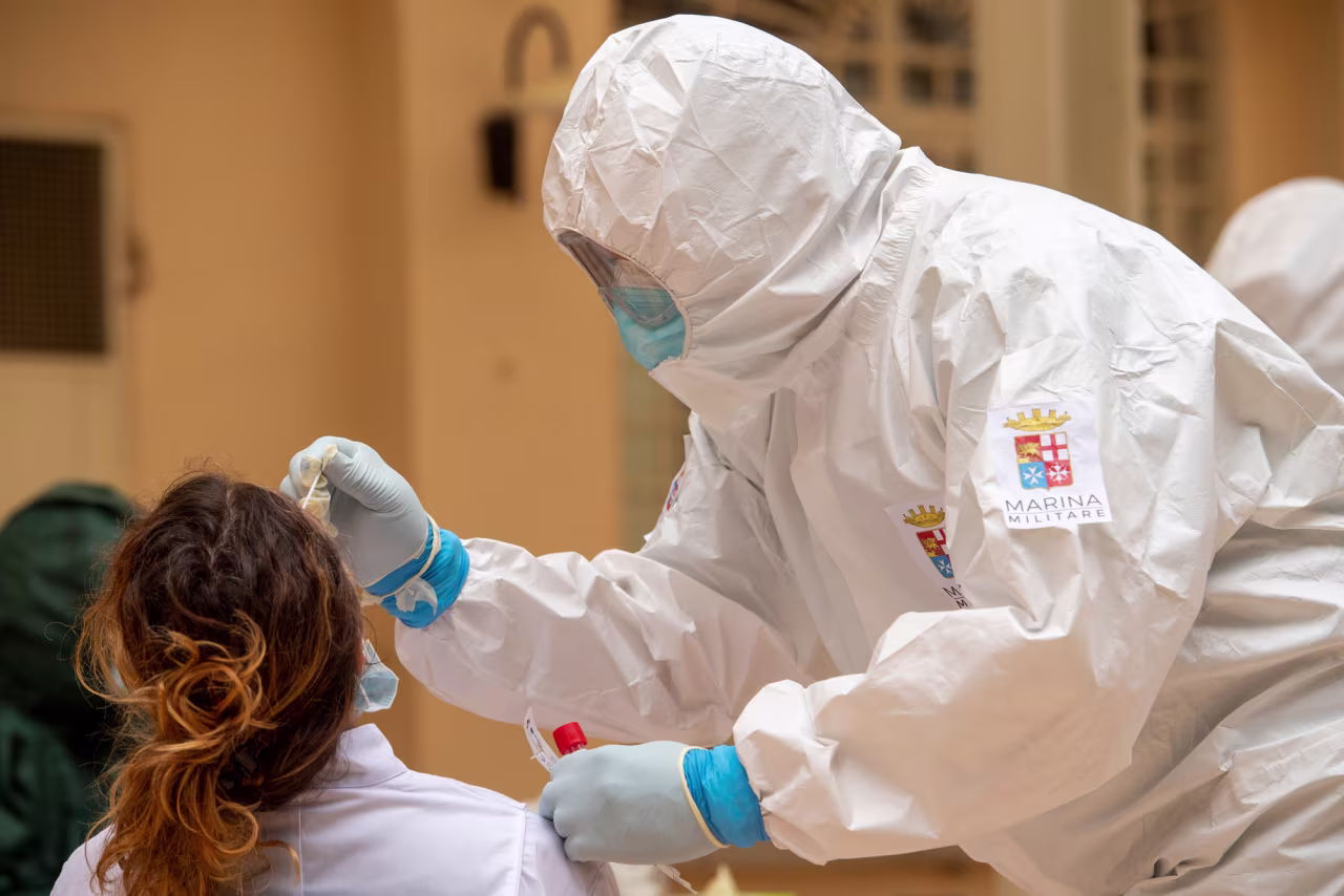 An Italian Navy doctor administers a Covid-19 test inside a health facility on May 21 in Tempio Pausania, Italy. 