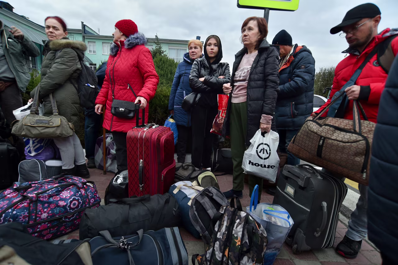 Evacuees from Kherson arrive at the railway station in Dzhankoi, Crimea, on Friday, October 21.