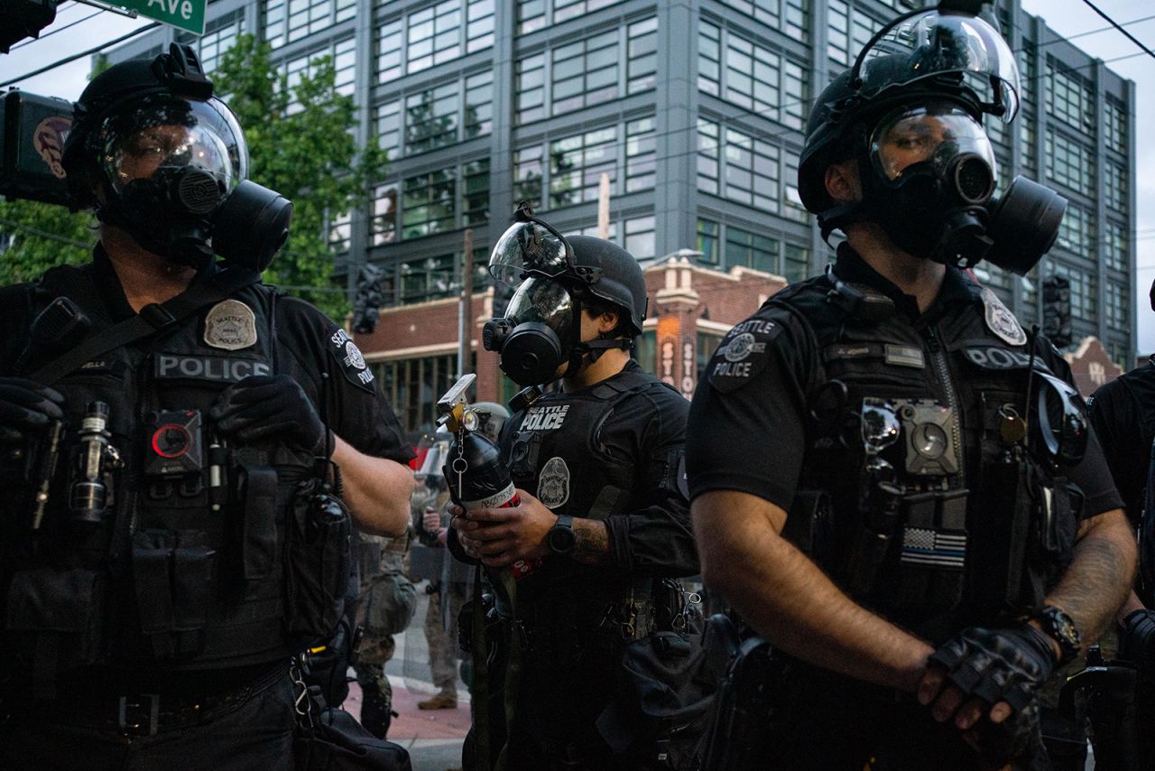 Police officers face off with demonstrators near the Seattle Police Department's East Precinct in Seattle, on June 6.