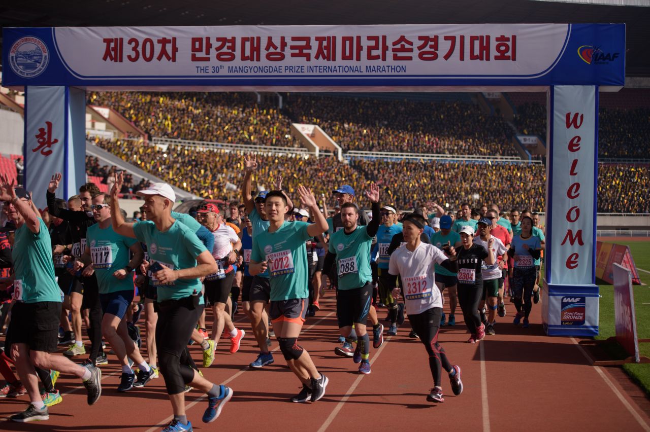 Foreign competitors cross the starting line during the annual 'Mangyongdae Prize International Marathon', at Kim Il Sung stadium in Pyongyang on April 7, 2019.