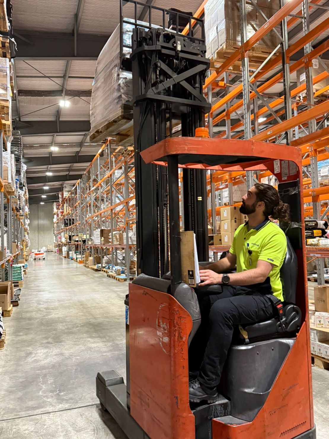 Tracey is working on the warehouse floor of a veterinary pharmaceutical company.
