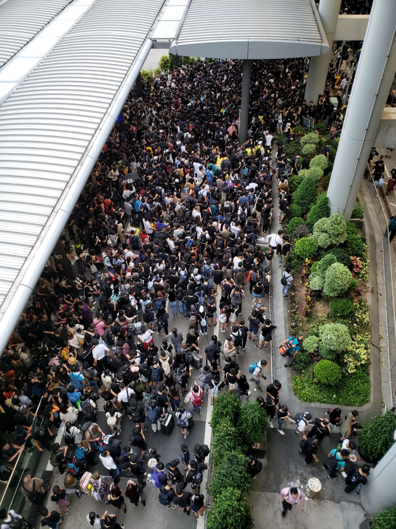 A line for the bus at the airport. Ben Westcott/CNN